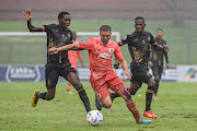 Elias Pelembe of Royal AM, Grant Margeman of Supersport United F.C and Kabelo Mahlasela of Royal AM during the DStv Premiership match between Royal AM and SuperSport United at Chatsworth Stadium on February 18, 2023 in Durban.