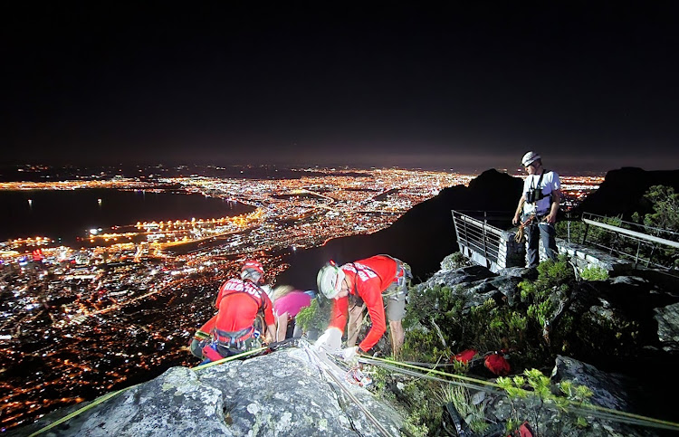 Technical rescuers responded after the woman was injured while scrambling from the top of a climbing route.