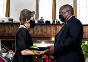 President Cyril Ramaphosa with Elita de Klerk, the wife of the late FW de Klerk, at the former deputy president's memorial service in Cape Town on Sunday. Ramaphosa confirmed on Sunday night that he had tested positive for Covid-19.