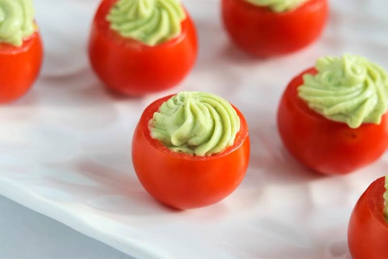 Cherry Tomato Stuffed With Avocado Filling.