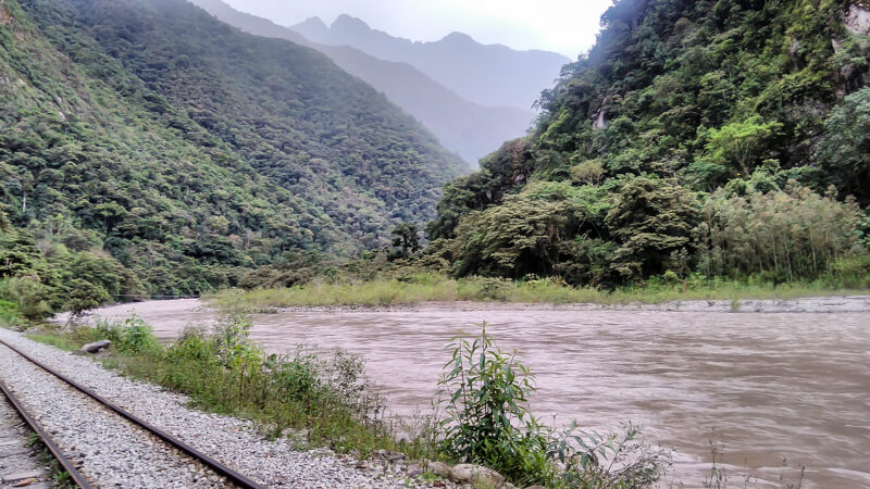 train+track+aguas+calientes to Machu picchu andes+mountains urubamba river in peru+south+america