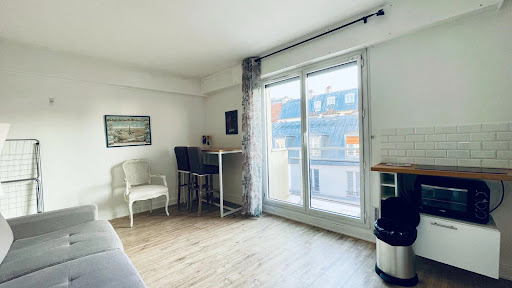Living room with dining area and city view - Buy this luxury property in Paris 18ème, 1 room