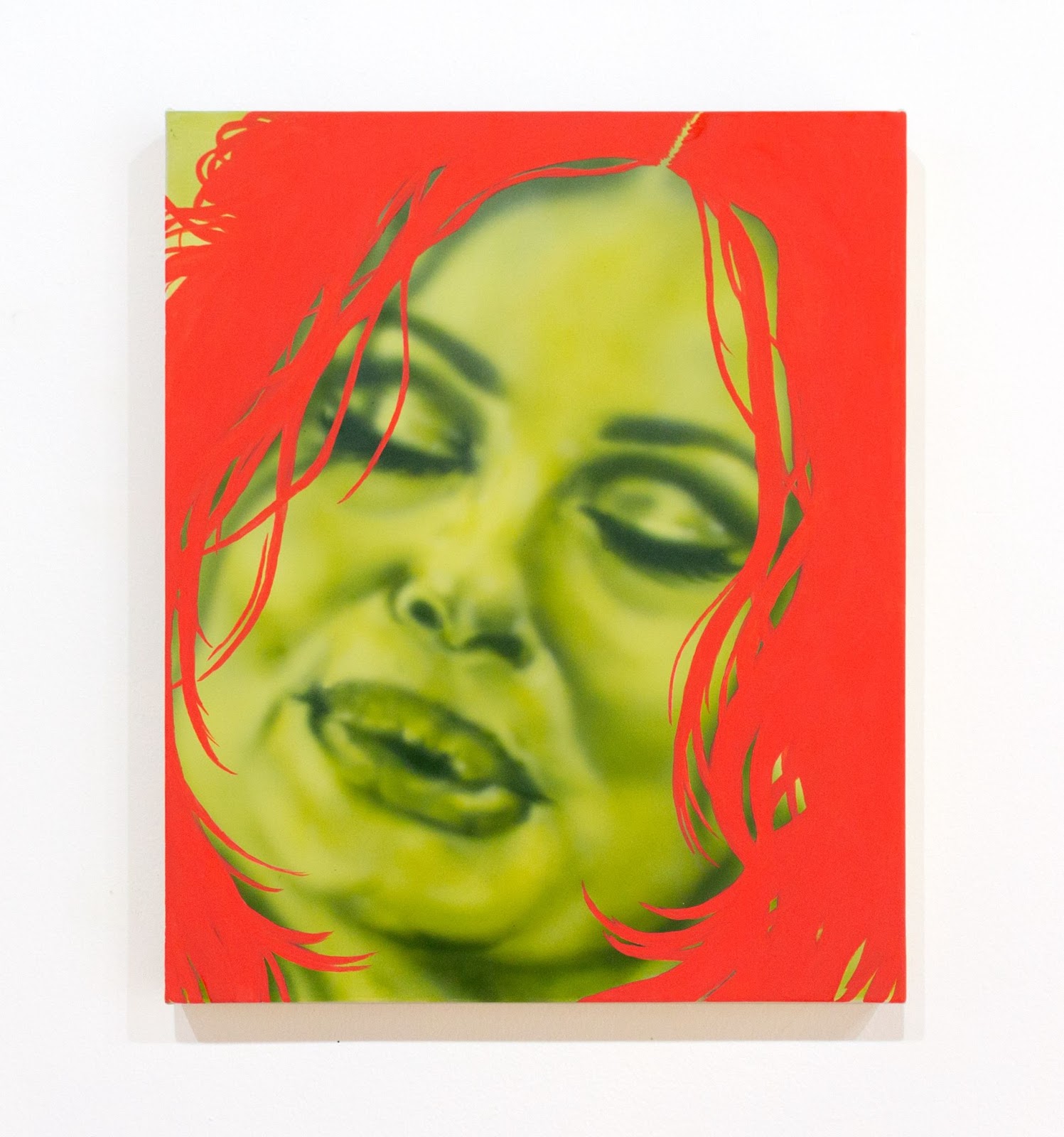 Image: Liza Jo Eilers, Infinitely Loaded, 2022. Acrylic and gouache on canvas, 15 x 18 in. Jennifer Coolidge’s face, rendered in fluorescent green, dominates the picture plane. Coolidge’s lips are lined and her eyeshadow glistens. Spiky coral lines act as hair and frame her portrait. Courtesy of the artist.  