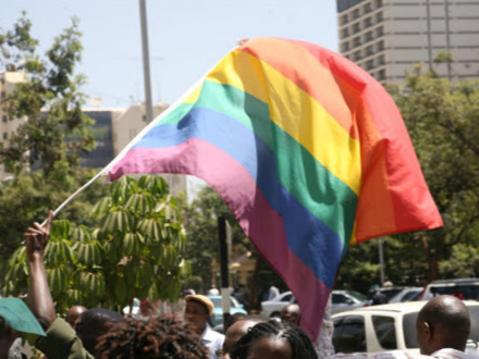 An activist waves a gay pride flag during a past protest in Nairobi.