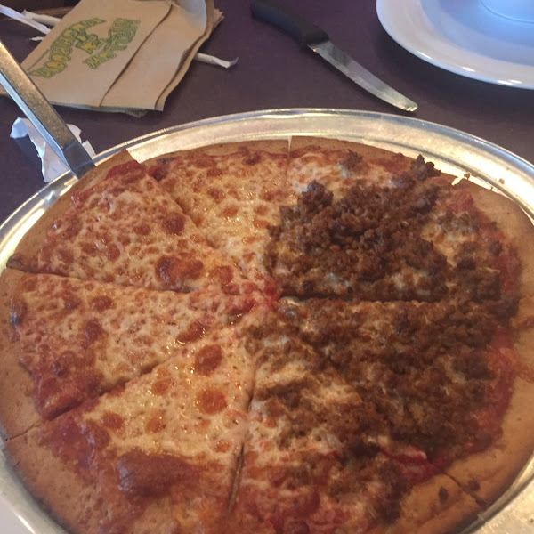 Yummy cheese pizza with half sausage