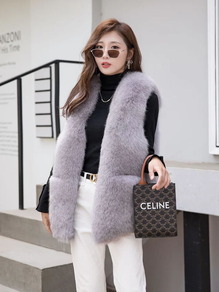 Gilet en fourrure de raton laveur véritable pour femme, automne et hiver, gilet en fourrure de renard tissée, sans manches, pour chaleur et style.