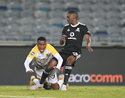 Abel Mabaso of Orlando Pirates challenges Ovidy Karuru of Black Leopards during the DStv Premiership match between Orlando Pirates and Black Leopards at Orlando Stadium on May 06, 2021 in Johannesburg, South Africa. 