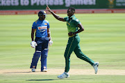 Lungi Ngidi (R) of South Africa celebrates the wicket of Avishka Fernando of Sri Lanka during the 5th Momentum ODI match between South Africa and Sri Lanka at PPC Newlands on March 16, 2019 in Cape Town, South Africa. 