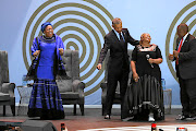 Madiba's widow  Graca Machel, former US president Barack Obama and President Cyril Ramaphosa dance while jazz singer Thandiswa Mazwai sings at the 16th annual Nelson Mandela lecture at the Wanderers Criket Stadium  in Johannesburg. 