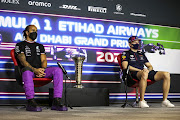 Lewis Hamilton of Great Britain and Mercedes GP, and Max Verstappen of Netherlands and Red Bull Racing talk in the Drivers Press Conference during previews ahead of the Formula One  Grand Prix of Abu Dhabi at Yas Marina Circuit on December 9, 2021 in Abu Dhabi, United Arab Emirates. 