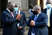 President Cyril Ramaphosa and acting chief justice Raymond Zondo outside the Union Buildings just before the latter handed over the first part of the state capture commission's report on Tuesday.