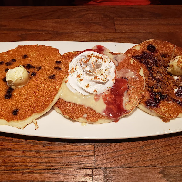 Gluten-free pancake flight. Chocolate chip, strawberry cheesecake and blueberry streusel. So delicious!!!