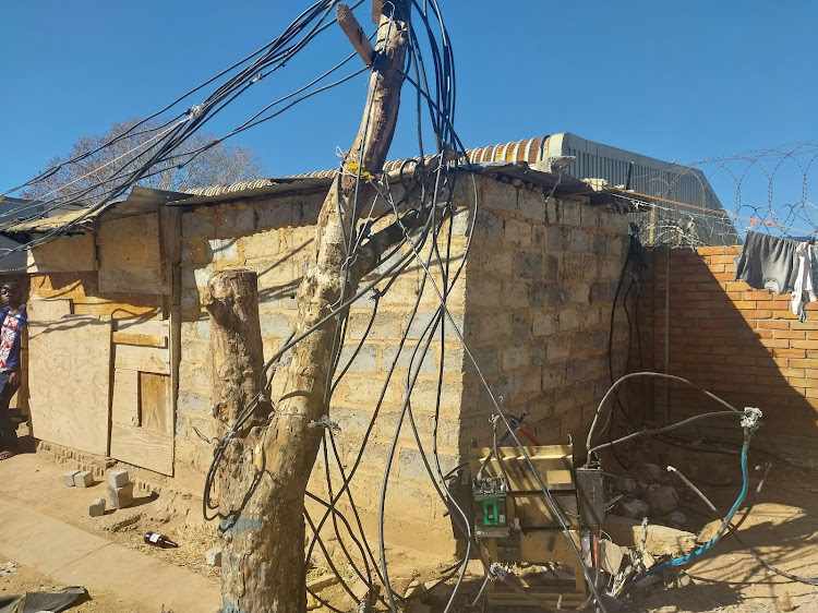 Eskom technicians had to abandon for their own safety their programme to cut illegal electricity connections in Marlboro, Johannesburg.