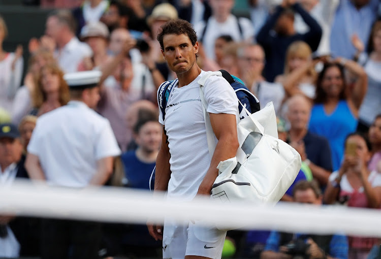 Spain’s Rafael Nadal reacts after losing his fourth round match against Luxembourg’s Gilles Muller