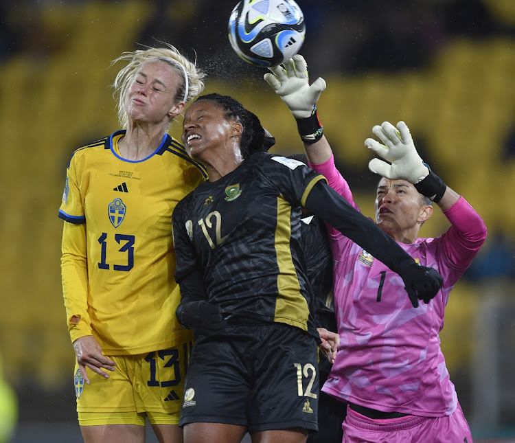 Banyana Banyana goalkeeper Kaylin Swart (right) and forward Jermaine Seoposenwe (centre) get up to challenge of Sweden's Amanda Ilestedt in the Fifa Women's World Cup group G match at Wellington Regional Stadium in New Zealand on on July 23 2023.