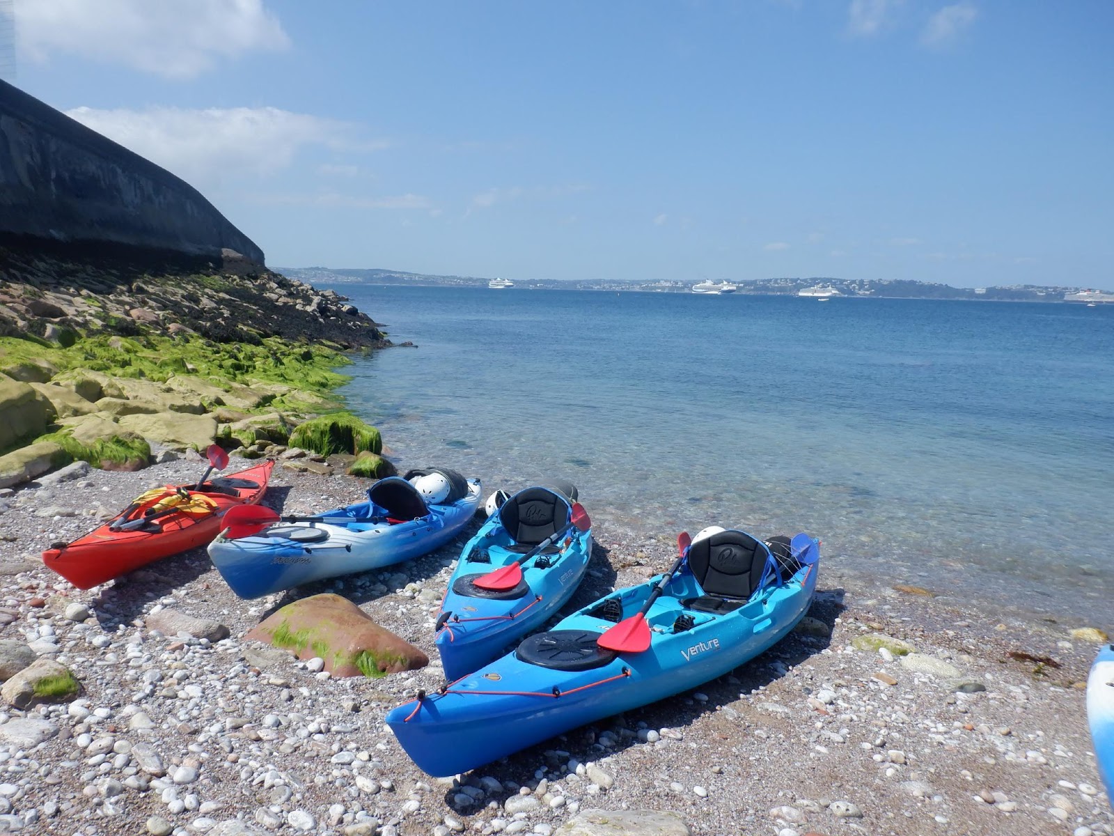 Kayaks on a rocky shore

Description automatically generated with low confidence