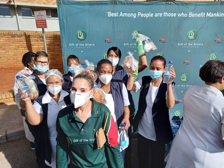 Gift of the Givers Eastern Cape co-ordinator Corene Conradie and her team hand out goodie bags to the hospital heroes at Uitehage Provincial Hospital on Wednesday in celebration of International Nurses' Day.