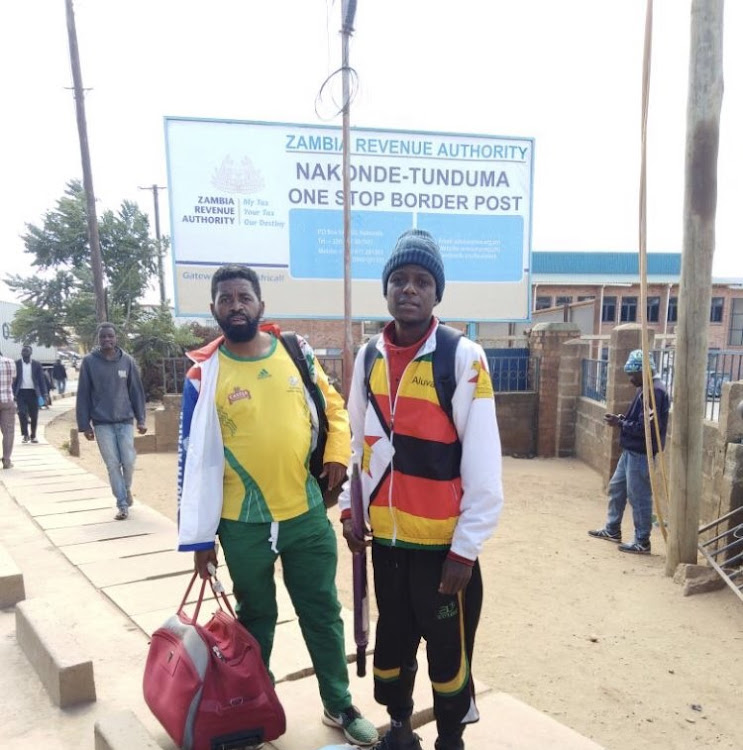 Soccer fans Botha Msila and his Zimbabwean travelling companion Alvin Zhakata