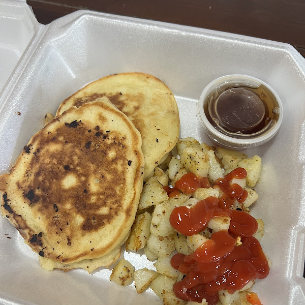 Chocolate chip pancakes, and side of breakfast potato potatoes