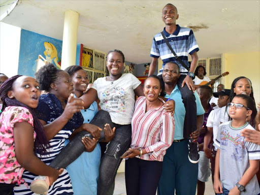 Pupils and teachers of Busy Bee Academy celebrate after the KCPE results were released on Monday, November 19. /JOHN CHESOLI