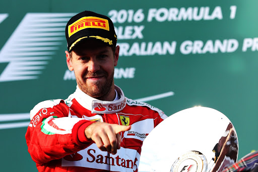 MELBOURNE, AUSTRALIA - MARCH 20: Sebastian Vettel of Germany and Ferrari celebrates on the podium during the Australian Formula One Grand Prix at Albert Park on March 20, 2016 in Melbourne, Australia. (Photo by Mark Thompson/Getty Images)