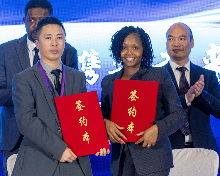 Ken Invest CEO June Chepkemei and a Chinese official after signing deal in Beijing, China on October 17, 2023