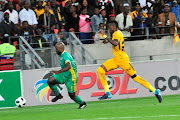 Matome Kgoetyane of Baroka FC chased by Teenage Hadebe during the 2018 Nedbank Cup quarterfinal game between Kaizer Chiefs and Baroka FC at Nelson Mandela Bay Stadium in Port Elizabeth on 31 March 2018.