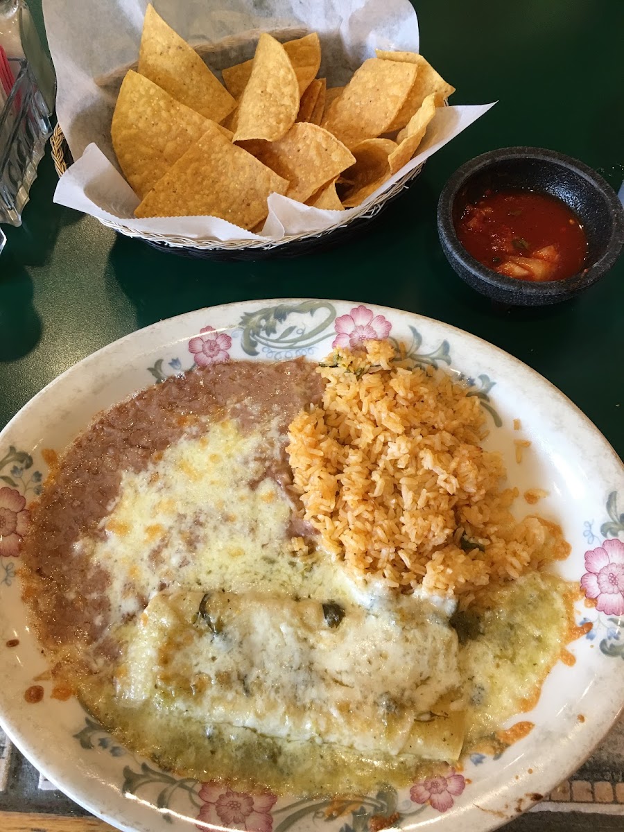 The “Small Plate.” One Cheese and Onion Enchilada with Green Sauce, with rice and beans. Complimentary chips and salsa.
