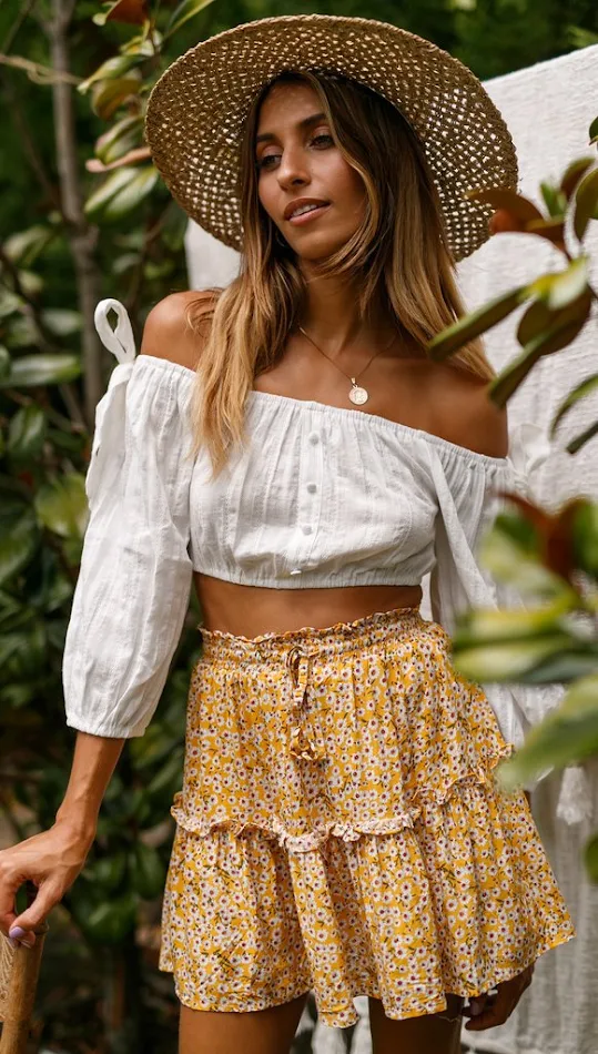 Falda floral con volantes y talle alto para mujer, elegante y cómoda. Ideal para looks casuales o más sofisticados. Perfecta para cualquier ocasión.