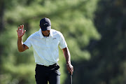 Tiger Woods of the US acknowledges the crowd walking to the 18th green in Saturday third round of the 2024 Masters at Augusta National Golf Club in Augusta, Georgia. 