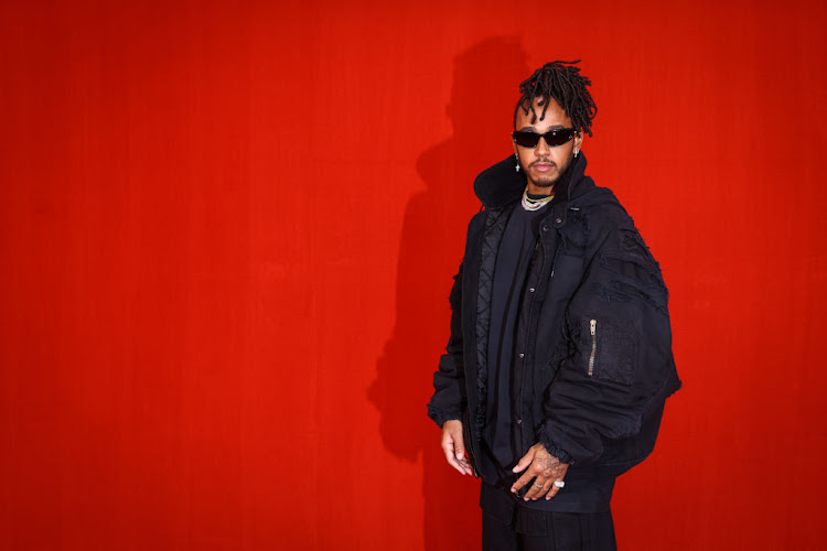 Lewis Hamilton poses on the runway during the Balenciaga Womenswear Spring/Summer 2022 show as part of Paris Fashion Week at Theatre Du Chatelet on October 2 in Paris.