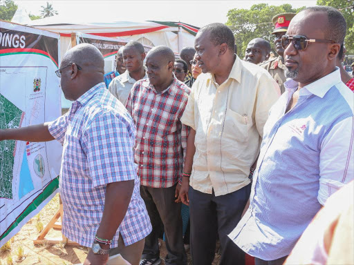 President Uhuru Kenyatta, Governor Hassan Joho and NLC chairman Muhammad Swazuri (left) are shown the layout of Waitiki Farm on january 11 / PSCU