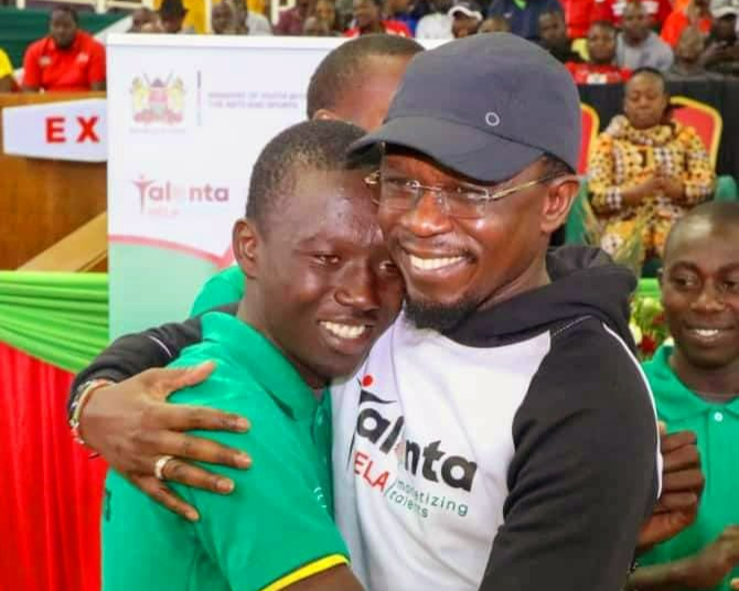 Sports CS Ababu Namwamba with Kenyan football young sensation Aldrine Kibet.