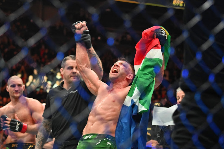 Dricus Du Plessis (right) celebrates defeating Sean Strickland (left) during UFC 297 at ScotiaBank Arena.