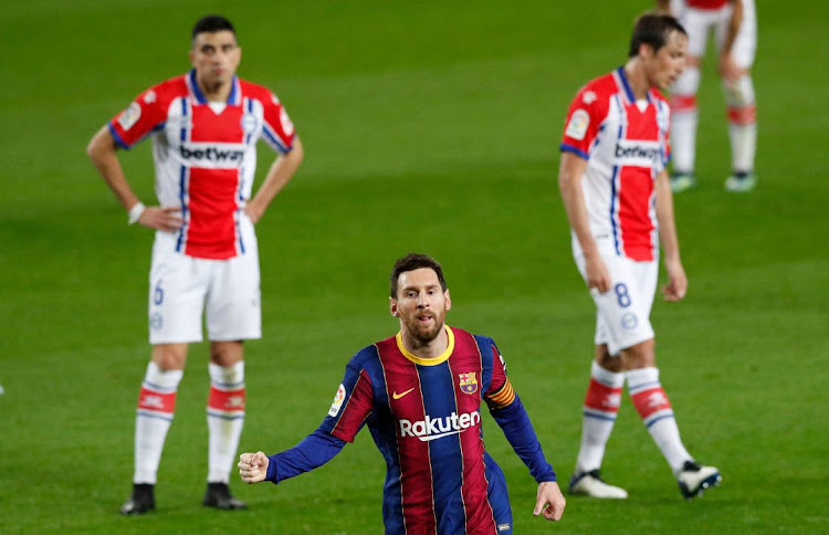 Barcelona's Lionel Messi celebrates scoring their second goal.