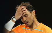 Spain's Rafael Nadal looks dejected after losing his second round match against Mackenzie Mcdonald of the US in the Australian Open at Melbourne Park on January 18 2023.
