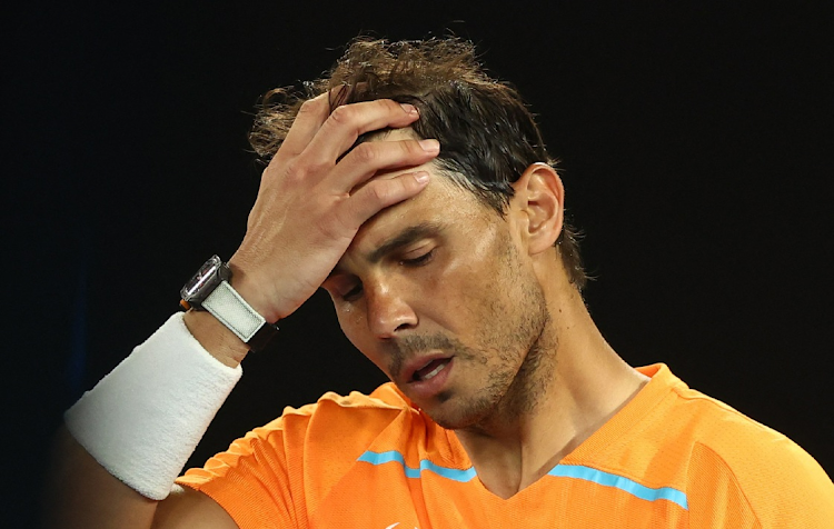 Spain's Rafael Nadal looks dejected after losing his second round match against Mackenzie Mcdonald of the US in the Australian Open at Melbourne Park on January 18 2023.