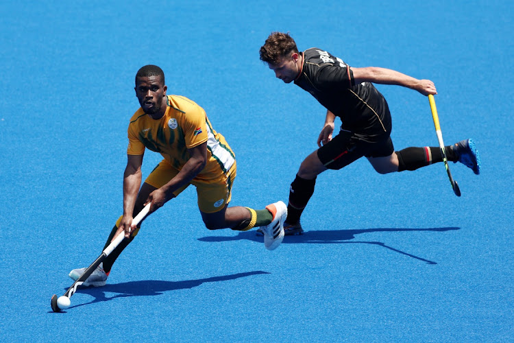 Samkelo Mvimbi of Team South Africa controls the ball during the Men's Preliminary Pool B match between South Africa and Germany on day six of the Tokyo 2020 Olympic Games at Oi Hockey Stadium on July 29, 2021 in Tokyo, Japan.