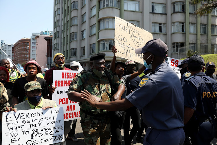 An MK vet exchanges some heated words with a policeman during a march in Durban on Monday