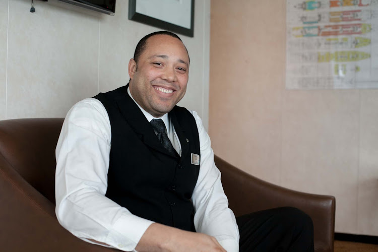 Anjoid Fabian Hurst, a waiter aboard Celebrity Infinity. 