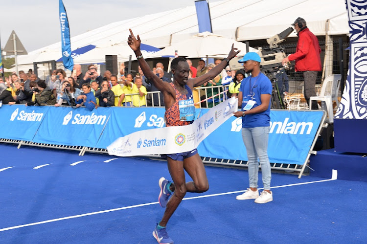 Kenya’s Edwin Koech crosses the finishing line first during the 2019 Cape Town Marathon.