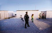 ON GUARD: Armed police officers accompanied a commission investigating the problems of policing in Khayelitsha.