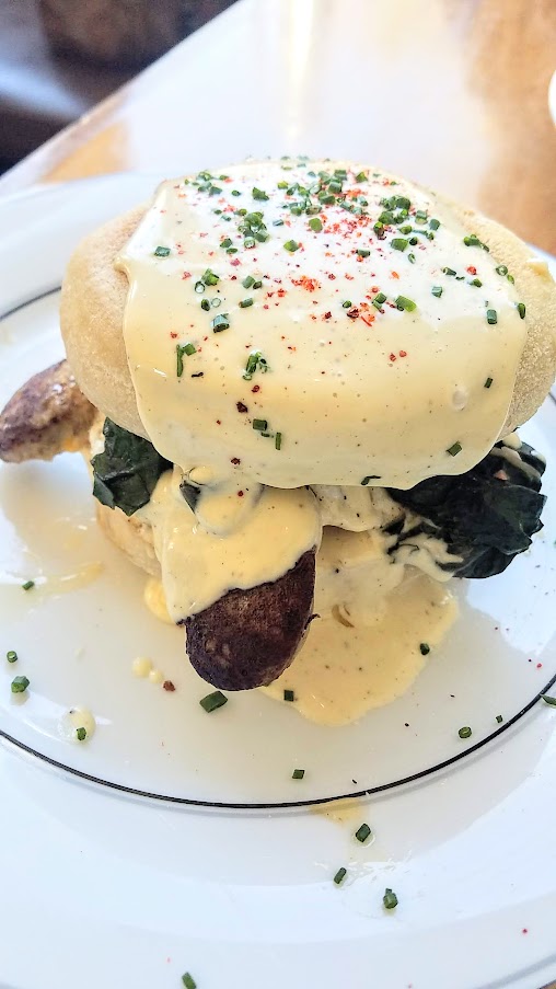 Brunch at St. Jack's: egg sandwich with foie gras boudin, cheddar, braised greens, bearnaise on an english muffin.