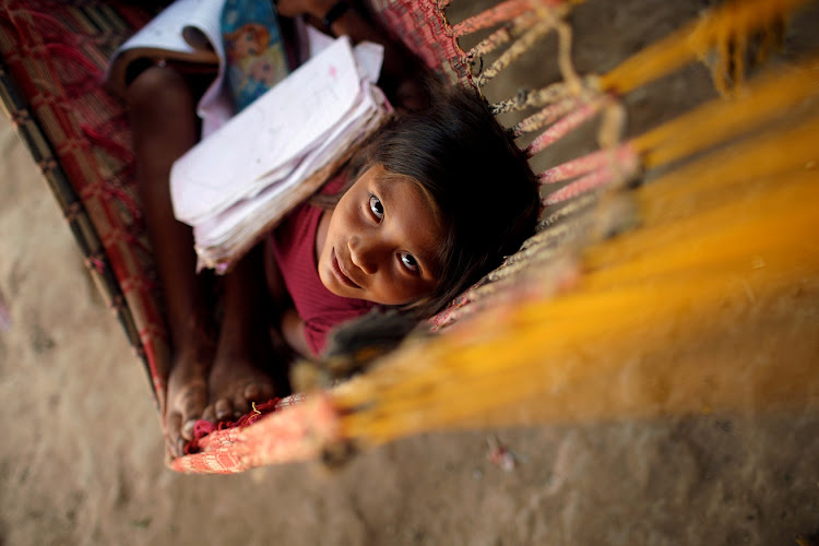 A Guajajara child looks on in the village of Urucu Jurua, Brazil.