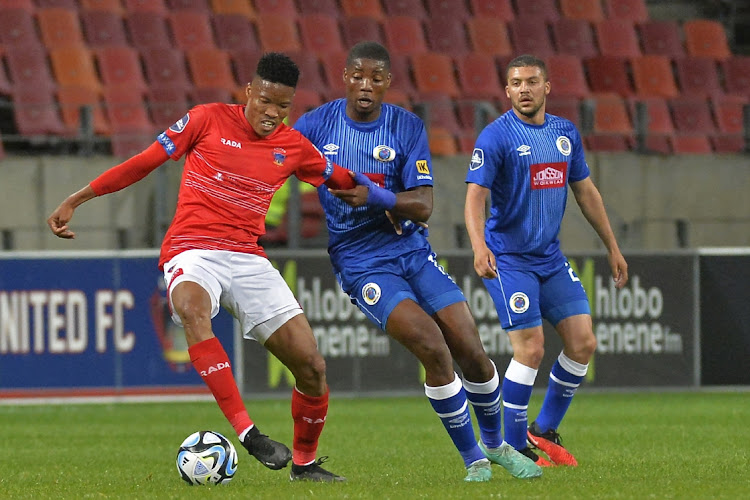 Elmo Kambindu of Chippa United and Ime Okonof Supersport United watched by Grant Margeman of Supersport United during the DStv Premiership 2023/24 game