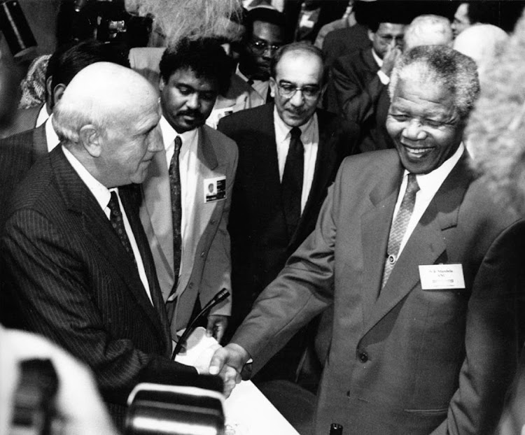 BIG SMILES: Then National Party representatives Pik Botha and FW de Klerk greet Nelson Mandela at Codesa in 1992.