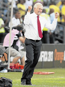 HAPPY COACH: Gordon Igesund celebrates Siyabonga Sangweni's goal against Angola on Wednesday