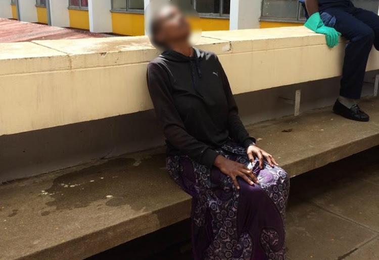 The woman seated at the KMTC block.