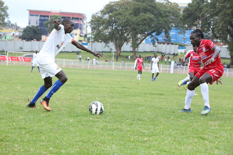 Shabana's Steve Ogati (L) in action against Posta Rangers during Kecoso games in Kisii