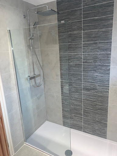 Complete bathroom refurbishment with a walk in shower tray and bath. Space saving toilet and basin units to create space. 